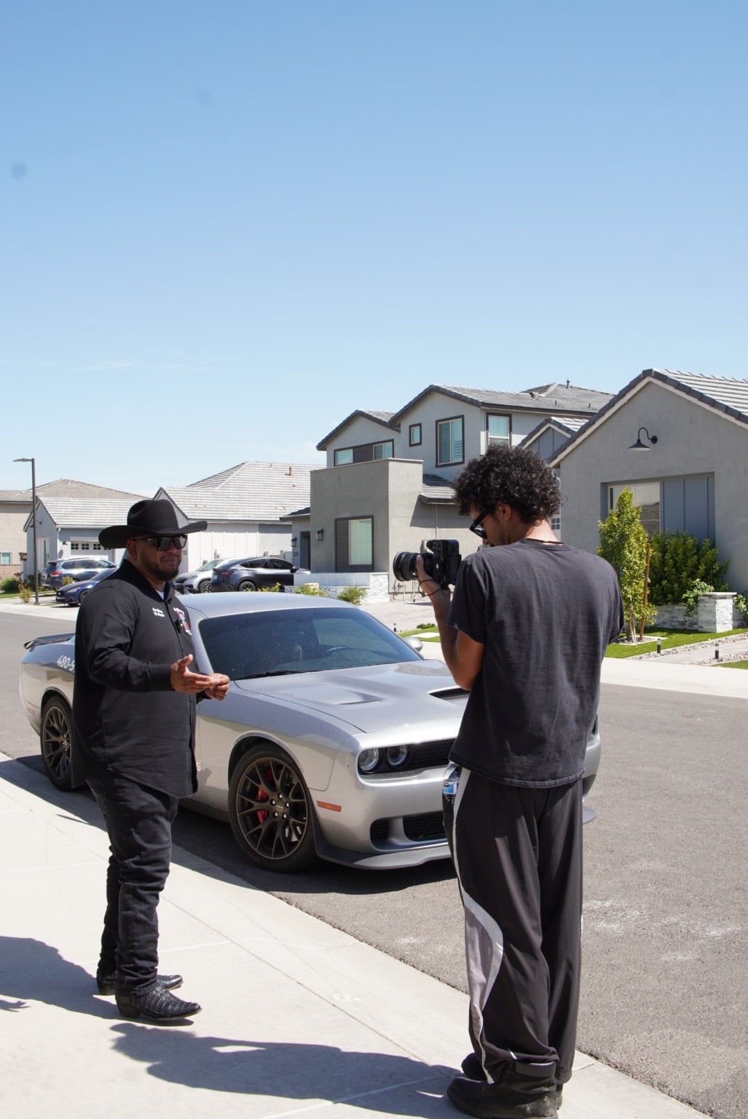 A Stray videographer recording a plumbing company representative on location